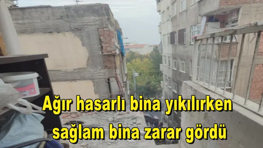 Ağır hasarlı bina yıkılırken  sağlam bina zarar gördü
